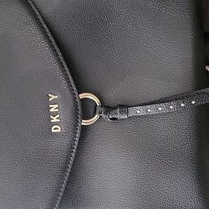 DKNY pebble leather backpack handbag with gold hardware.